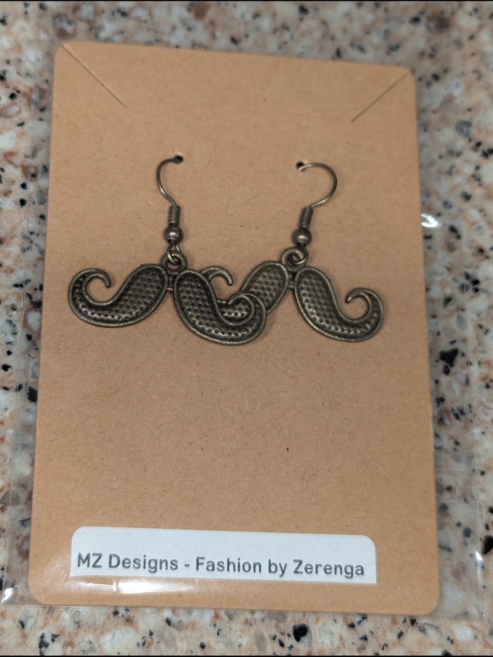 MZ Designs Bronze Mustache Hook Earrings by Zere nga